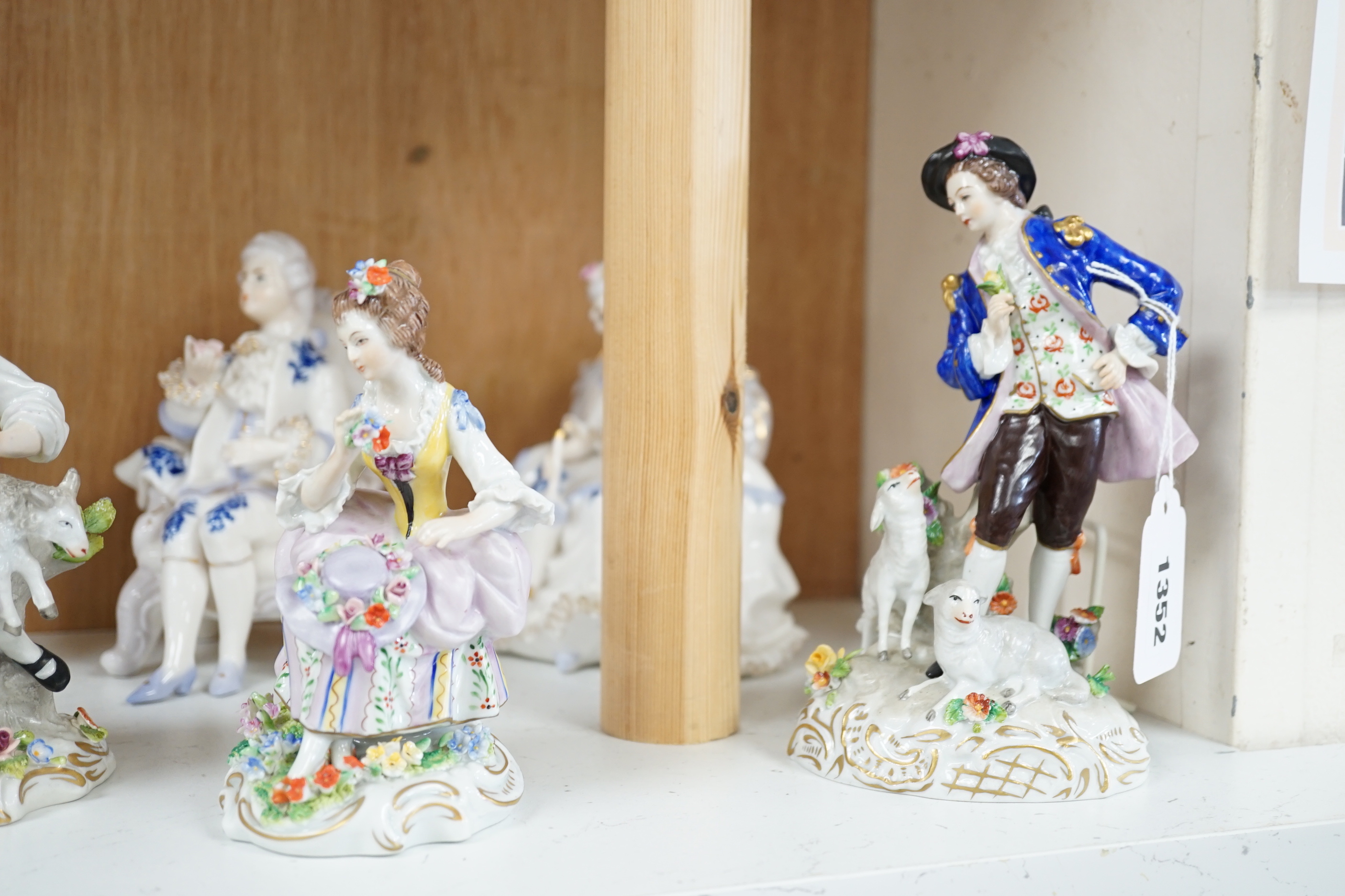 A quantity of porcelain figures and groups including eight Sitzendorf examples and Royal Doulton Marie, HN1635, the largest 19cm high